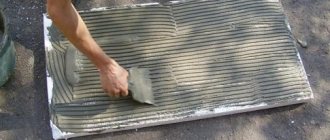 Applying glue to a sheet of foam plastic