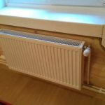 Радиатор отопления под окном