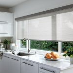 Wide roller blind on the kitchen window