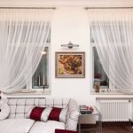 Symmetrical window decoration with tulle curtains